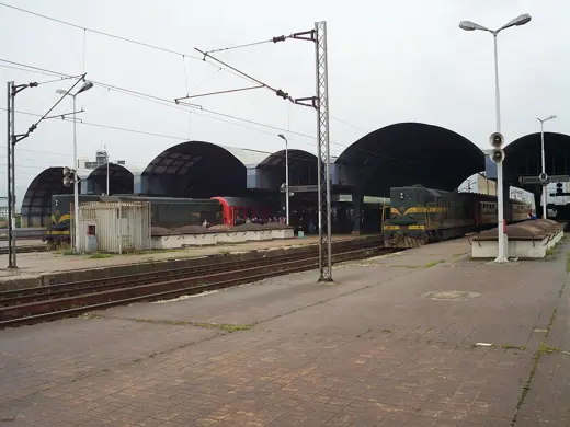 Photo 2: Exterior · Platforms of a train station in Skopje , Macedonia, with two passenger trains