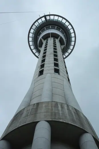 Photo 3: Exterior · View looking up Sky Tower, Auckland on a cloudy day