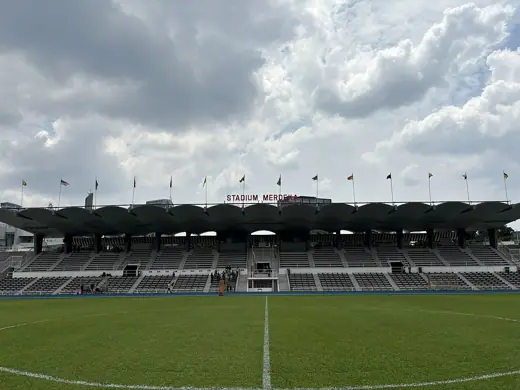 Photo 4: Context · View from field towards grandstand, Stadium Merdeka