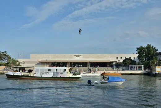 Photo 4: Exterior · Vaporetto on the Canal Grande and the Santa Lucia station in Venice 