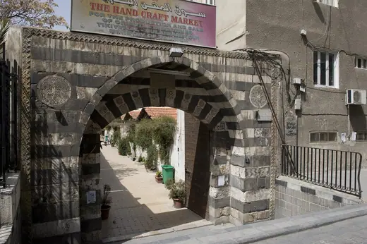 Photo 6: Interior · Entrance to the corridor along the shops at the east side