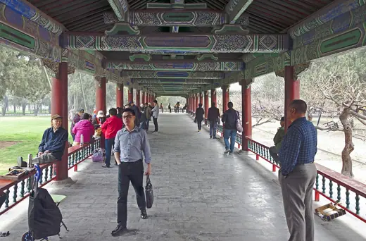 Photo 5: Interior · People, primarily locals, in the Long Corridor at the Temple of Heaven Park in Beijing