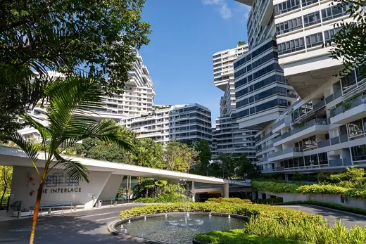 Photo 4: Exterior · The Interlace entrance sign and fountain, with the apartments in the background