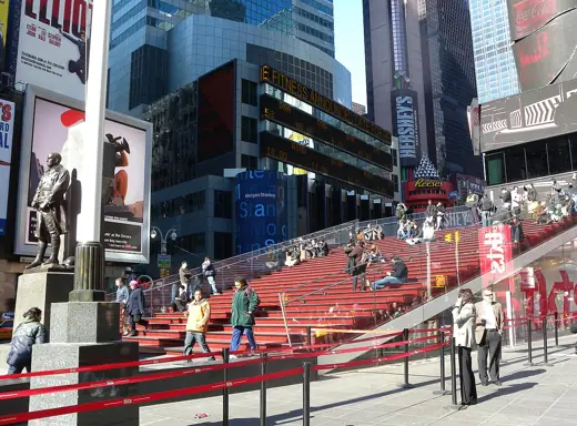 Photo 5: Interior · Looking north at red stairs of en:TKTS booth on a sunny early afternoon