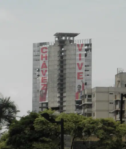 Photo 3: Exterior · Centro Financiero Confinanzas draped with banners saying "Chávez Lives"