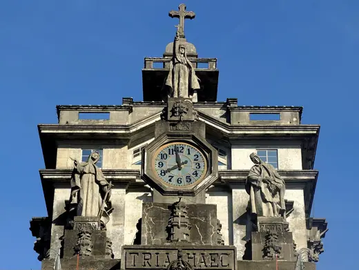 Photo 6: Detail · Tria Haec sculptures by Monti at the top of UST Main Building