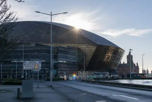 Photo 2: Exterior · Wales Millennium Centre as viewed from Lloyd George Avenue on a sunny winter's morning in January 2023